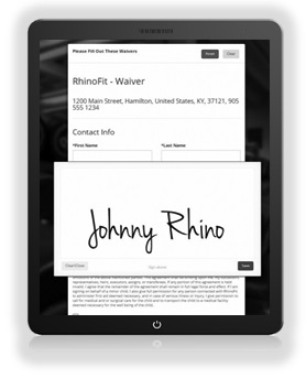 Someone electronically signing a RhinoFit digital waiver