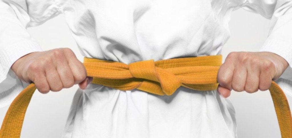 Image of an orange Karate belt representing one of the karate belt colors and ranking levels