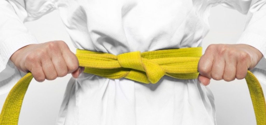 Image of a yellow Karate belt representing one of the karate belt levels and ranking system