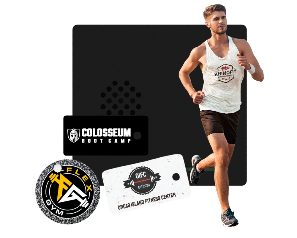 Image of a man running with RhinoFit's 24 hours gym access control system along with custom key cards used for gym check-in with our fitness software