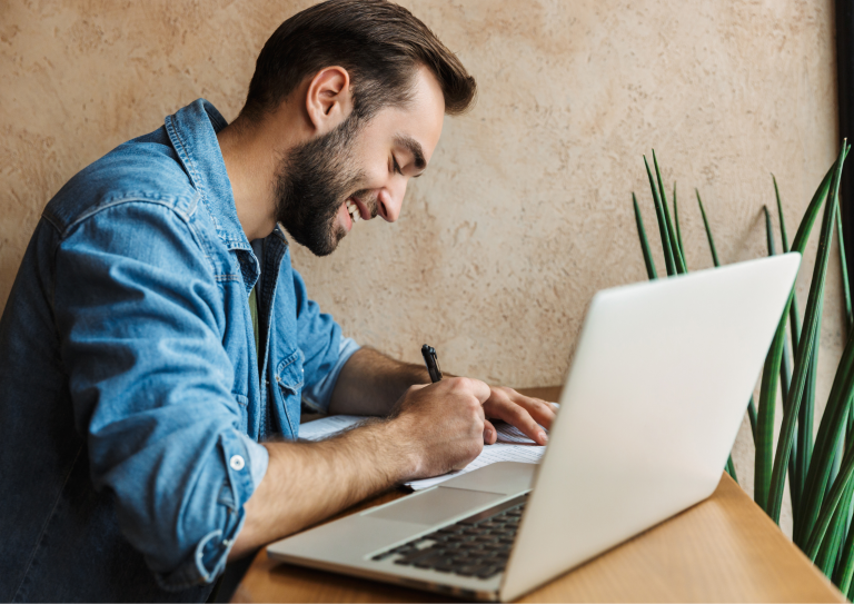 An image of a man writing his fitness blog