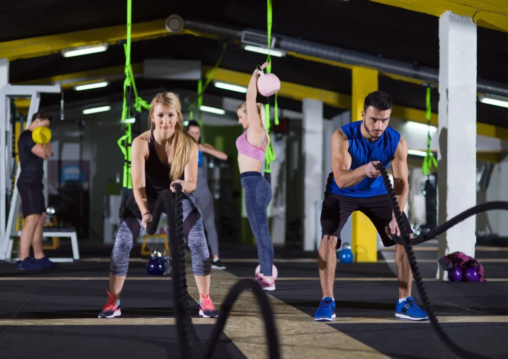 Image of a man and woman working out in a CrossFit type of gym