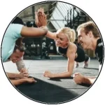 Image of two members high fiving each other at a gym