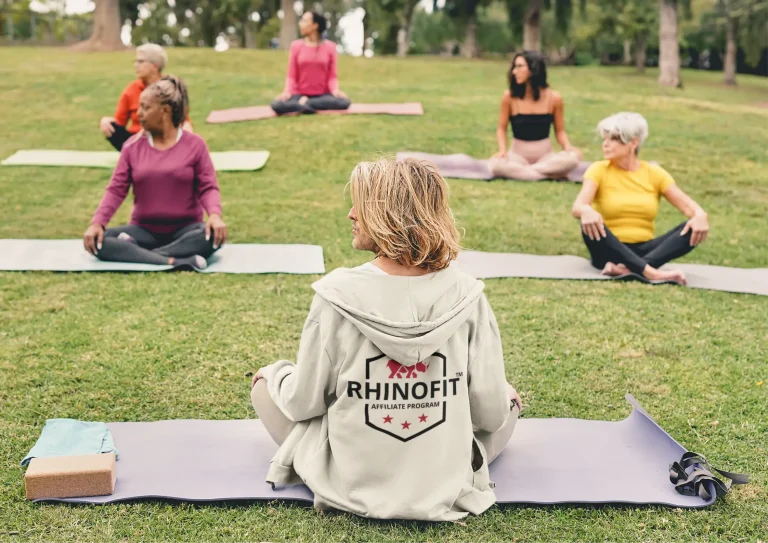 Image of a yoga class performing Yin Yoga outside